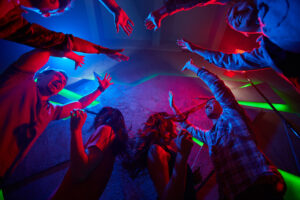 Laughing friends having fun in night club